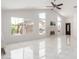 Bright and airy living room with large windows, fireplace, and sleek tile floors, showcasing an open-concept design at 3608 W Morelos St, Chandler, AZ 85226