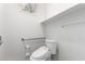 Clean bathroom with a modern toilet and grab bar for accessibility, featuring a bright, minimalist design at 3608 W Morelos St, Chandler, AZ 85226