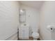 Bathroom featuring white brick wall, vanity and toilet at 3622 W Sunland Ave, Phoenix, AZ 85041