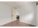 This bedroom offers new flooring and access to another living space at 3622 W Sunland Ave, Phoenix, AZ 85041