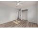 Bedroom featuring hardwood-style floors, a ceiling fan, and closet space at 3622 W Sunland Ave, Phoenix, AZ 85041