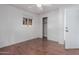 Bedroom features new flooring, ceiling fan, window, and closet at 3622 W Sunland Ave, Phoenix, AZ 85041