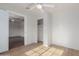 This bedroom offers new flooring, a ceiling fan and a closet at 3622 W Sunland Ave, Phoenix, AZ 85041
