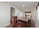 Dining room featuring hardwood floors, recessed lighting, and a large wood table at 3622 W Sunland Ave, Phoenix, AZ 85041