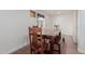 Dining room featuring hardwood floors and a large wood table at 3622 W Sunland Ave, Phoenix, AZ 85041