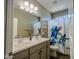 Bathroom with double vanity, a decorative shower curtain, and neutral wall color at 37008 N Aleutian Dr, San Tan Valley, AZ 85143
