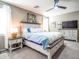 Comfortable bedroom with a ceiling fan, stylish furniture, and soft lighting for a relaxing ambiance at 37008 N Aleutian Dr, San Tan Valley, AZ 85143