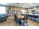 Dining area that connects to the modern kitchen, featuring decorative shelving, and a formal dining table at 37008 N Aleutian Dr, San Tan Valley, AZ 85143