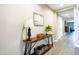 Bright hallway with neutral paint, a decorative table, and tasteful decor at 37008 N Aleutian Dr, San Tan Valley, AZ 85143