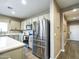 Modern kitchen featuring stainless steel appliances and a view of the entry at 37008 N Aleutian Dr, San Tan Valley, AZ 85143