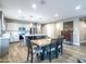 Open concept space with a kitchen featuring an island bar, which connects to the dining area at 37008 N Aleutian Dr, San Tan Valley, AZ 85143