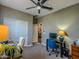 Home office area with a desk, office chair, and neutral carpet flooring at 37008 N Aleutian Dr, San Tan Valley, AZ 85143