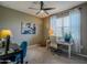 Bright home office featuring a desk, comfortable chairs, and a window with natural light at 37008 N Aleutian Dr, San Tan Valley, AZ 85143