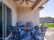 Covered patio with comfortable seating, ceiling fan, and string lights perfect for outdoor relaxation at 37008 N Aleutian Dr, San Tan Valley, AZ 85143