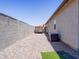 Practical side yard featuring gravel landscaping and a storage container, perfect for organization at 37008 N Aleutian Dr, San Tan Valley, AZ 85143