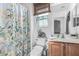 Bathroom featuring a sink vanity, toilet, and shower/bath combo with curtain at 3755 E Hazeltine Way, Chandler, AZ 85249