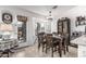 Bright dining room with a wooden table and a view to the backyard, perfect for Gathering meals at 3755 E Hazeltine Way, Chandler, AZ 85249