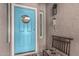 Charming front door with 'Welcome' sign, decorated with a cozy bench, and wind chimes at 3755 E Hazeltine Way, Chandler, AZ 85249