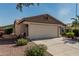 Two-car garage with desert landscaping, located in a quiet residential neighborhood at 3755 E Hazeltine Way, Chandler, AZ 85249