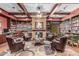 Elegant living room with fireplace, built-in bookshelves, and cozy seating at 3755 E Hazeltine Way, Chandler, AZ 85249