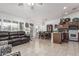 Open floor plan features a spacious living room with tile floors and natural light from window shutters at 3755 E Hazeltine Way, Chandler, AZ 85249