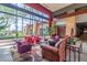 A luxurious lobby with modern furniture, a stone accent wall, and a large window with a view of the outdoors at 3755 E Hazeltine Way, Chandler, AZ 85249