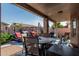 Inviting covered patio equipped with lounge chairs and BBQ, perfect for relaxation and gatherings at 3755 E Hazeltine Way, Chandler, AZ 85249
