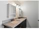 Elegant bathroom featuring double sinks with granite countertops, providing ample space and style at 4613 S Rita Ln, Tempe, AZ 85282