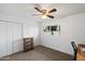 Bright bedroom with closet space, window, and neutral walls, ready for personalization at 4613 S Rita Ln, Tempe, AZ 85282