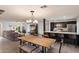 Bright dining area adjacent to kitchen featuring modern lighting and open layout at 4613 S Rita Ln, Tempe, AZ 85282