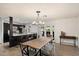Bright dining area adjacent to kitchen featuring modern lighting and table at 4613 S Rita Ln, Tempe, AZ 85282