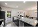 Stylish kitchen with dark cabinetry, stainless steel appliances, and granite countertops, perfect for cooking at 4613 S Rita Ln, Tempe, AZ 85282