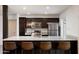 Modern kitchen with stainless steel appliances and granite countertops and bar seating at 4613 S Rita Ln, Tempe, AZ 85282