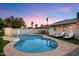 Inviting pool area with a sparkling pool, comfortable lounge chairs, and a neatly landscaped yard at 4613 S Rita Ln, Tempe, AZ 85282
