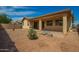 Backyard featuring a covered patio and natural desert landscaping at 5312 S 33Rd Ave, Phoenix, AZ 85041