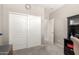 Neutral bedroom features closet with sliding doors and views to adjacent rooms at 5312 S 33Rd Ave, Phoenix, AZ 85041