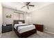 Neutral bedroom featuring carpet floors, a ceiling fan, and plenty of space at 5312 S 33Rd Ave, Phoenix, AZ 85041