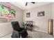 Carpeted bedroom featuring a massage chair, ceiling fan, and natural light at 5312 S 33Rd Ave, Phoenix, AZ 85041