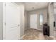 The entryway features tile flooring, neutral paint and a window for natural light at 5312 S 33Rd Ave, Phoenix, AZ 85041