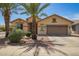 Inviting single-story home featuring desert landscaping and a two-car garage with a neutral color scheme at 5312 S 33Rd Ave, Phoenix, AZ 85041