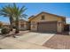 Attractive single-story home with a desert-themed front yard and a convenient two-car garage at 5312 S 33Rd Ave, Phoenix, AZ 85041
