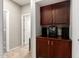 Hallway with built-in cabinets that have speakers and an electronic radio at 5312 S 33Rd Ave, Phoenix, AZ 85041