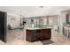 Kitchen with dark wood cabinets, granite countertops, and a tile backsplash at 5312 S 33Rd Ave, Phoenix, AZ 85041