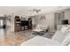 Open-concept living room features tile flooring, neutral paint, and ample natural light at 5312 S 33Rd Ave, Phoenix, AZ 85041