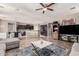 Open-concept area includes a living room and kitchen with tile flooring and neutral colors at 5312 S 33Rd Ave, Phoenix, AZ 85041
