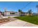 Expansive backyard has artificial turf, mature trees and covered patio, perfect for outdoor entertaining at 554 N Sunset Dr, Chandler, AZ 85225