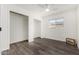 A spacious bedroom with wood-look floors and closet to store your personal belongings at 554 N Sunset Dr, Chandler, AZ 85225