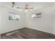 This bedroom features natural light, wood flooring, and modern finishes at 554 N Sunset Dr, Chandler, AZ 85225