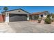Charming residence featuring a well-kept garage, low-maintenance yard, and a sunny facade at 554 N Sunset Dr, Chandler, AZ 85225