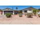 Charming single-story home featuring a low-maintenance yard and decorative accents over the brickwork at 554 N Sunset Dr, Chandler, AZ 85225